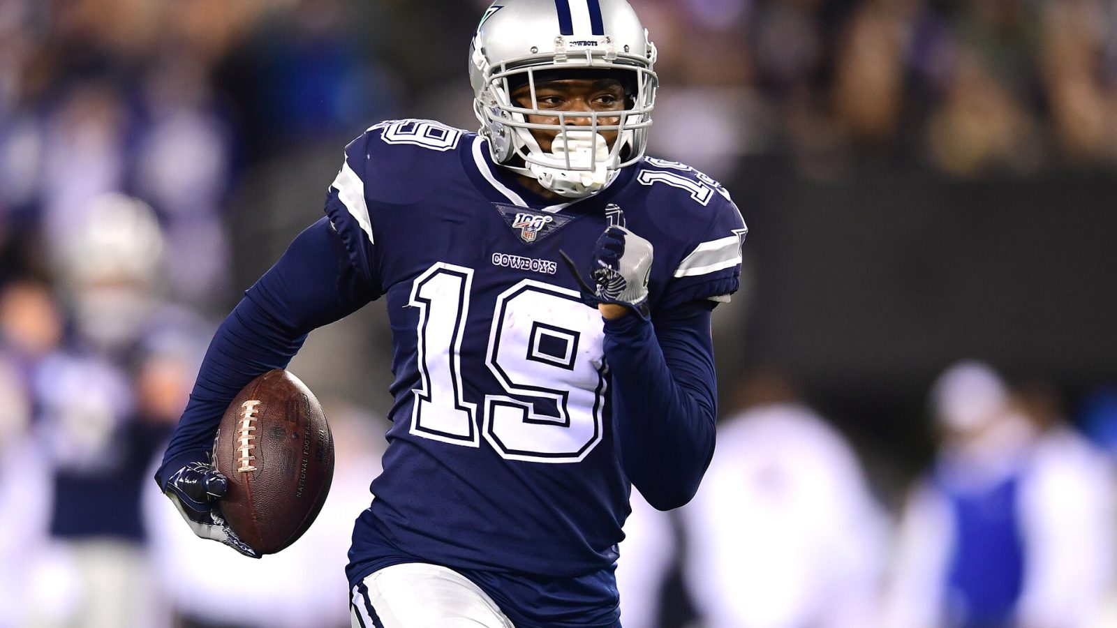 Dallas Cowboys wide receiver Amari Cooper running with the football