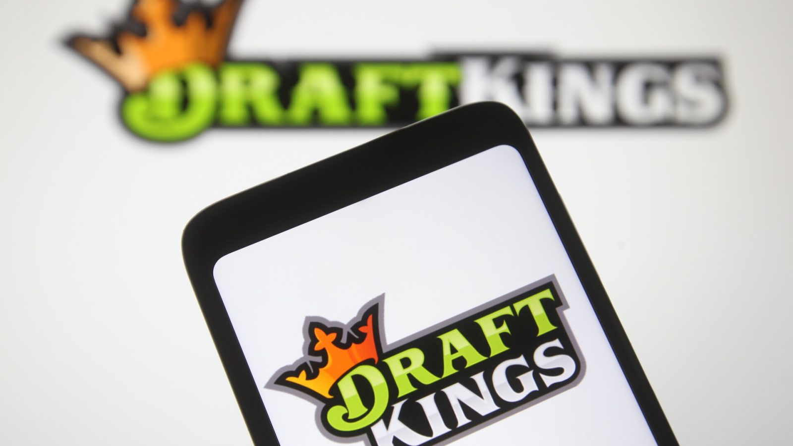 In this photo illustration a DraftKings logo, of the U.S. daily fantasy sports contest and sports betting operator, is seen on a mobile phone screen