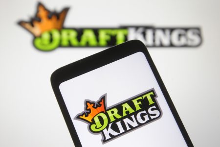 In this photo illustration a DraftKings logo, of the U.S. daily fantasy sports contest and sports betting operator, is seen on a mobile phone screen