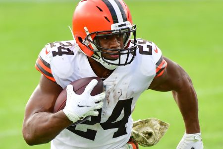 Cleveland Browns running back Nick Chubb runs with the ball during a game.
