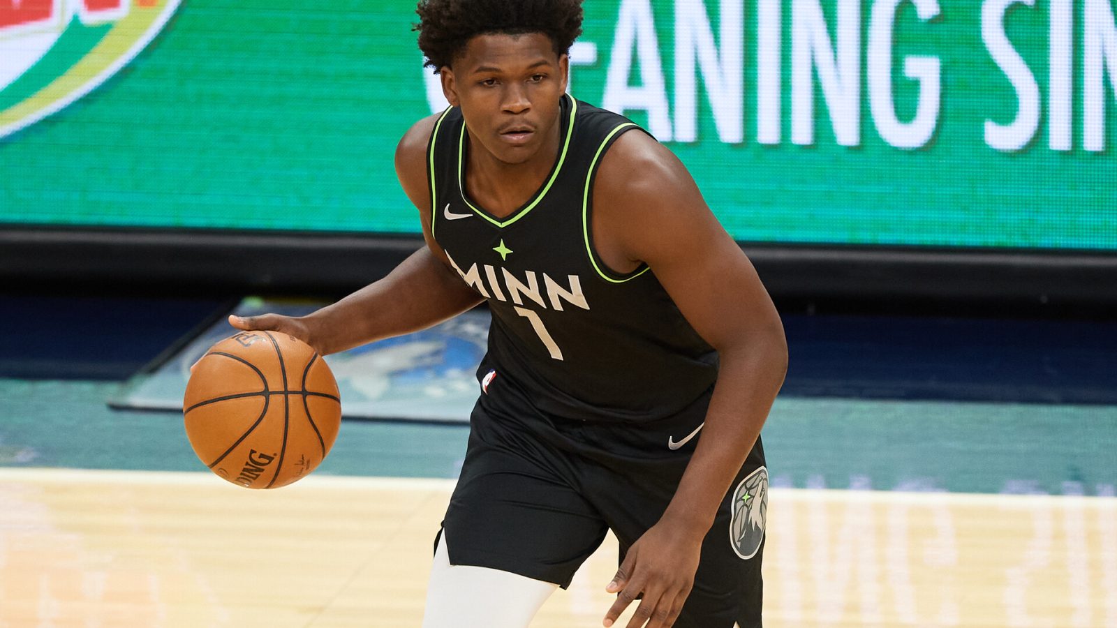 Anthony Edwards #1 of the Minnesota Timberwolves brings the ball up the floor in an NBA game in 2021.