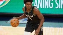NBA DFS Injury Report: Anthony Edwards #1 of the Minnesota Timberwolves brings the ball up the floor in an NBA game in 2021.