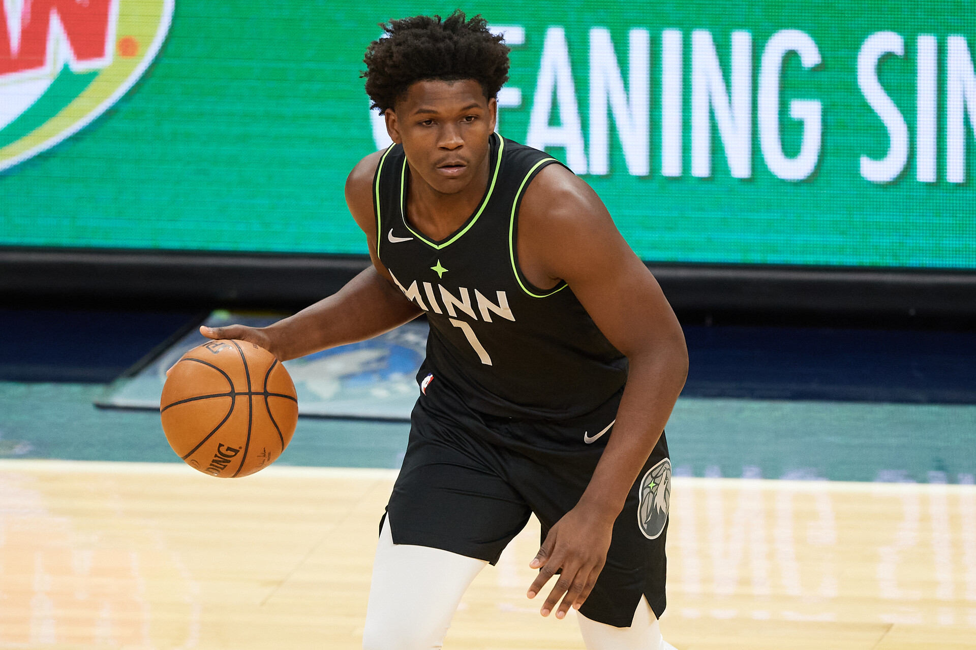 Anthony Edwards #1 of the Minnesota Timberwolves brings the ball up the floor in an NBA game in 2021.