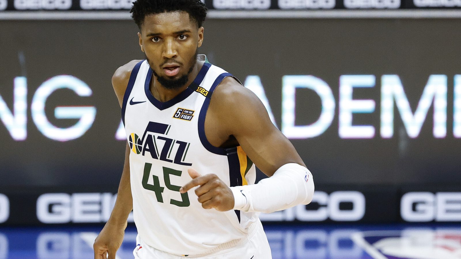 Utah Jazz guard #45 Donovan Mitchell runs back after a made basket in a 2021 home game.