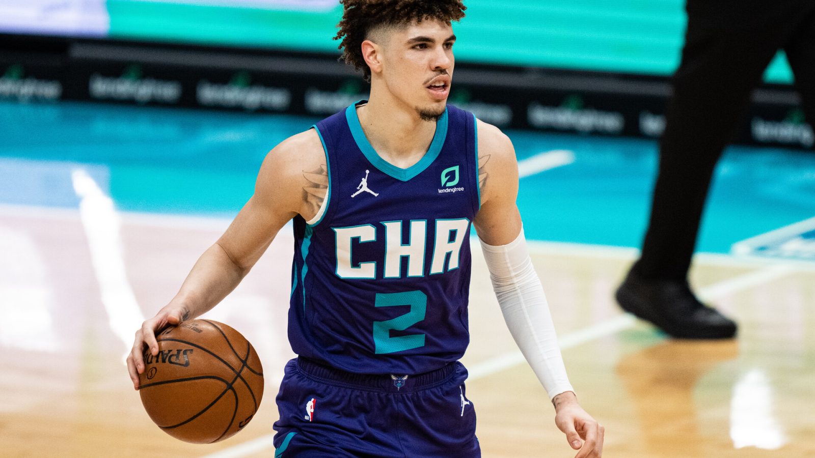 LaMelo Ball brings the ball up the court for the Charlotte Hornets in a 2021 home game.