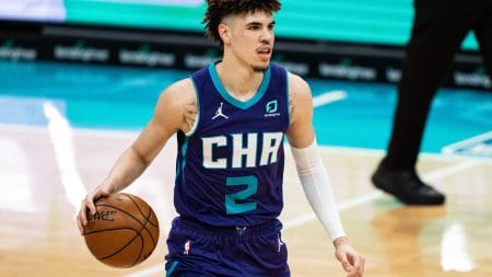 LaMelo Ball brings the ball up the court for the Charlotte Hornets in a 2021 home game.