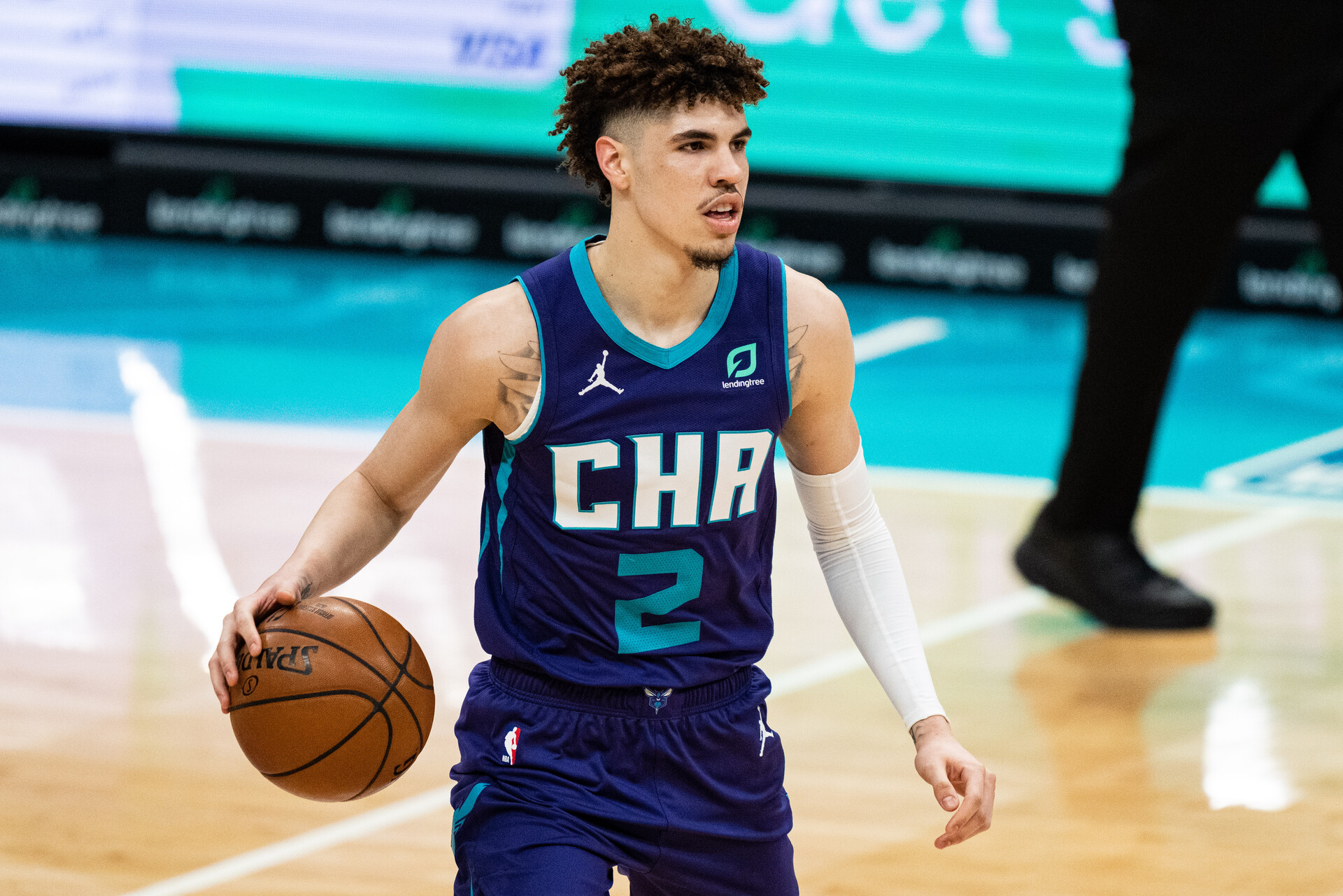 LaMelo Ball brings the ball up the court for the Charlotte Hornets in a 2021 home game.