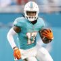 Miami Dolphins wide receiver #17 Jaylen Waddle runs with the ball in a 2021 home game.