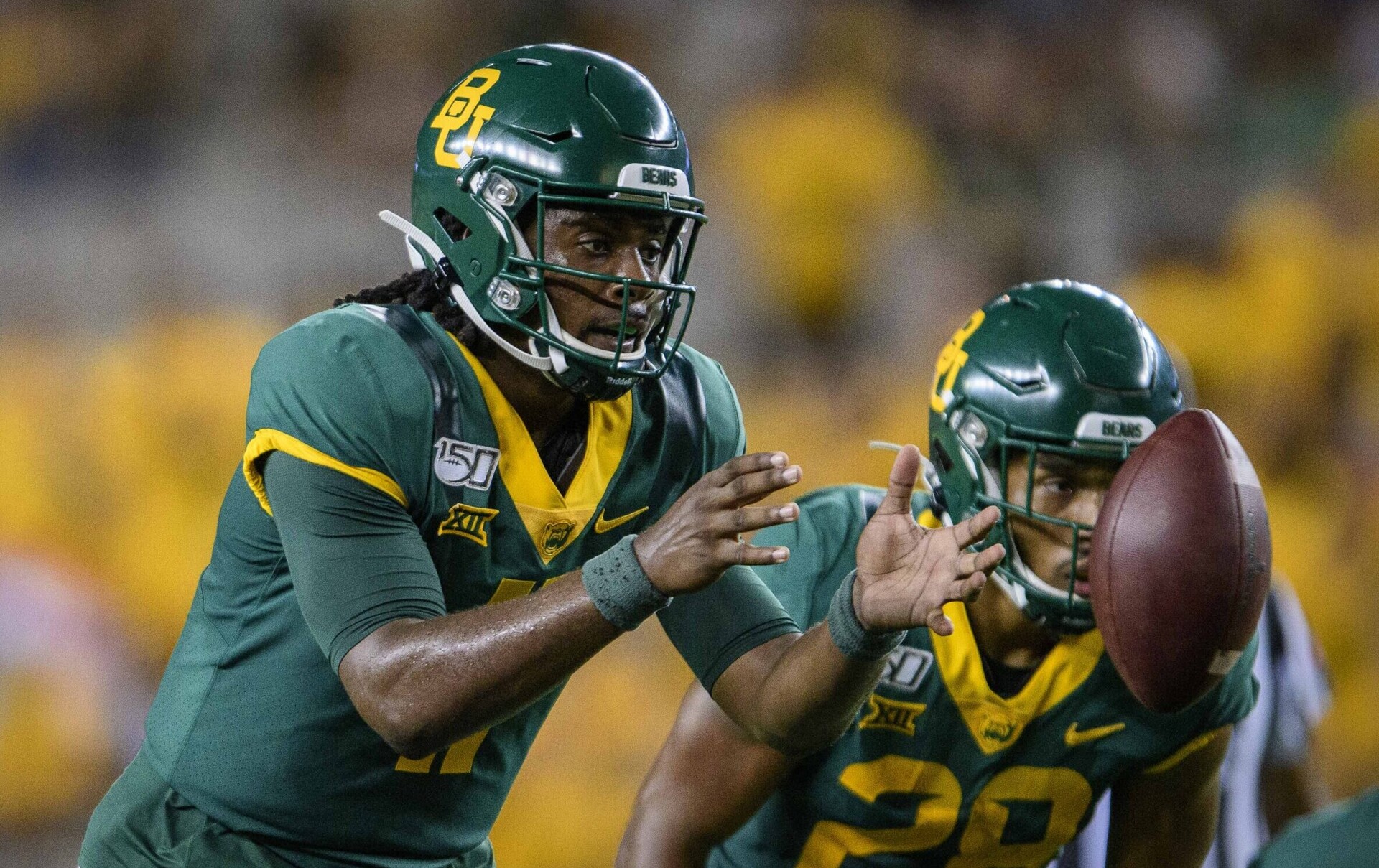Baylor Bears quarterback #11 Gerry Bohanon takes the snap in a 2021 home game.