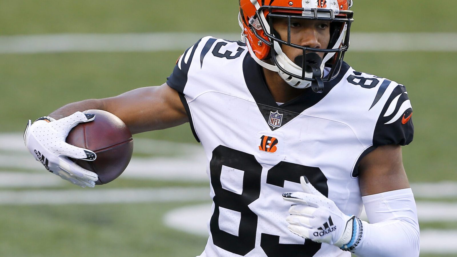 Bengals wide receiver #83 Tyler Boyd runs upfield during a 2021 road game.
