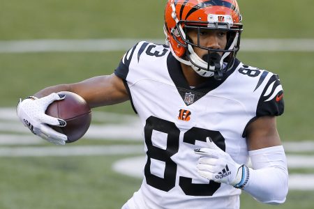 Bengals wide receiver #83 Tyler Boyd runs upfield during a 2021 road game.