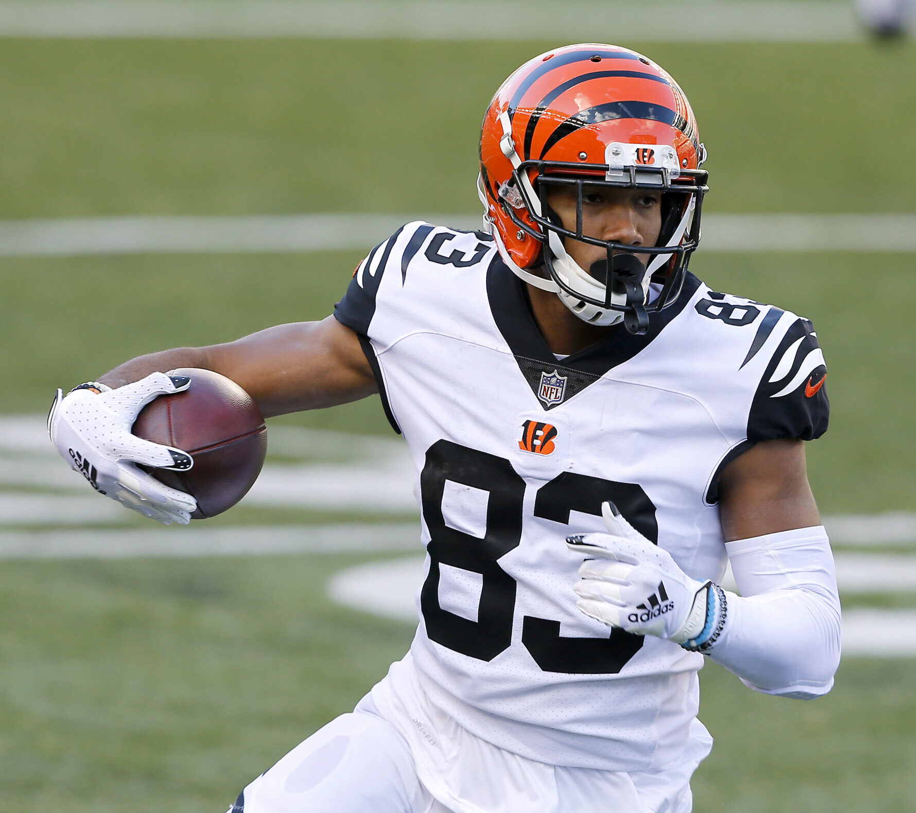 Bengals wide receiver #83 Tyler Boyd runs upfield during a 2021 road game.