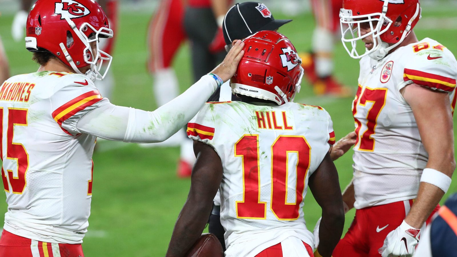 Kansas City Chiefs teammates Patrick Mahomes, Tyreek Hill and Travis Kelce celebrate during a 2021-22 regular-season game.