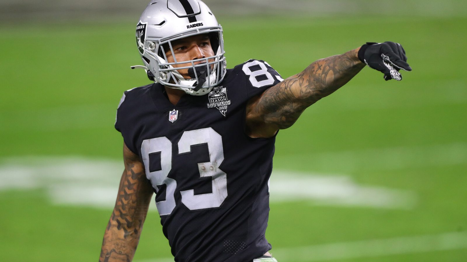 Las Vegas Raiders tight end #83 Darren Waller lines up for the next play in a 2021 home game.