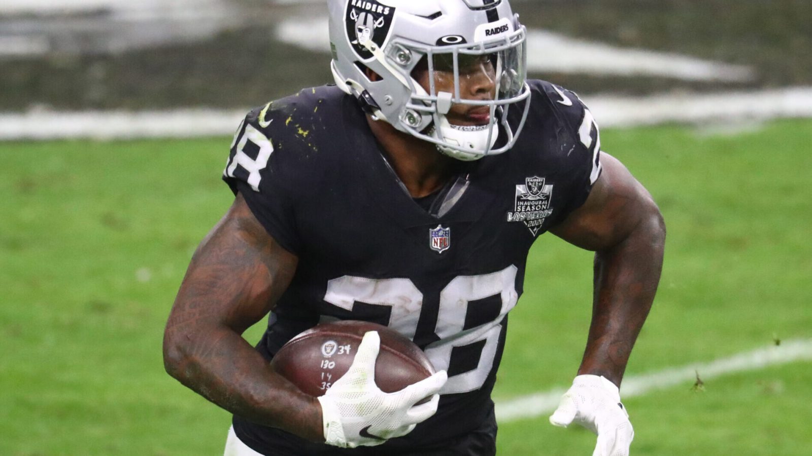 Las Vegas Raiders running back Josh Jacobs runs with the football during a game