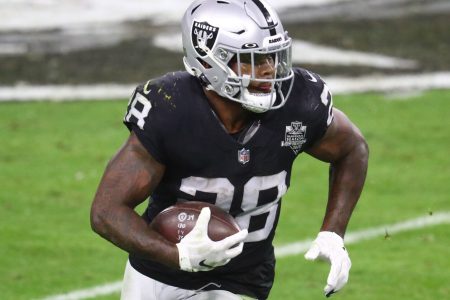 Las Vegas Raiders running back Josh Jacobs runs with the football during a game