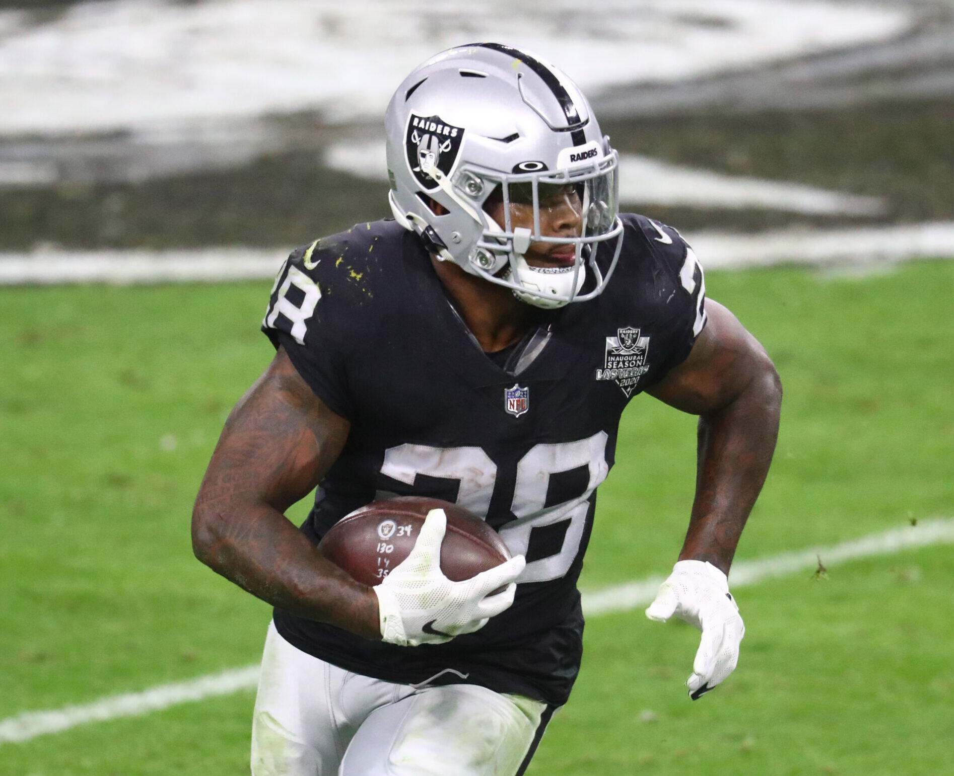 Las Vegas Raiders running back Josh Jacobs runs with the football during a game