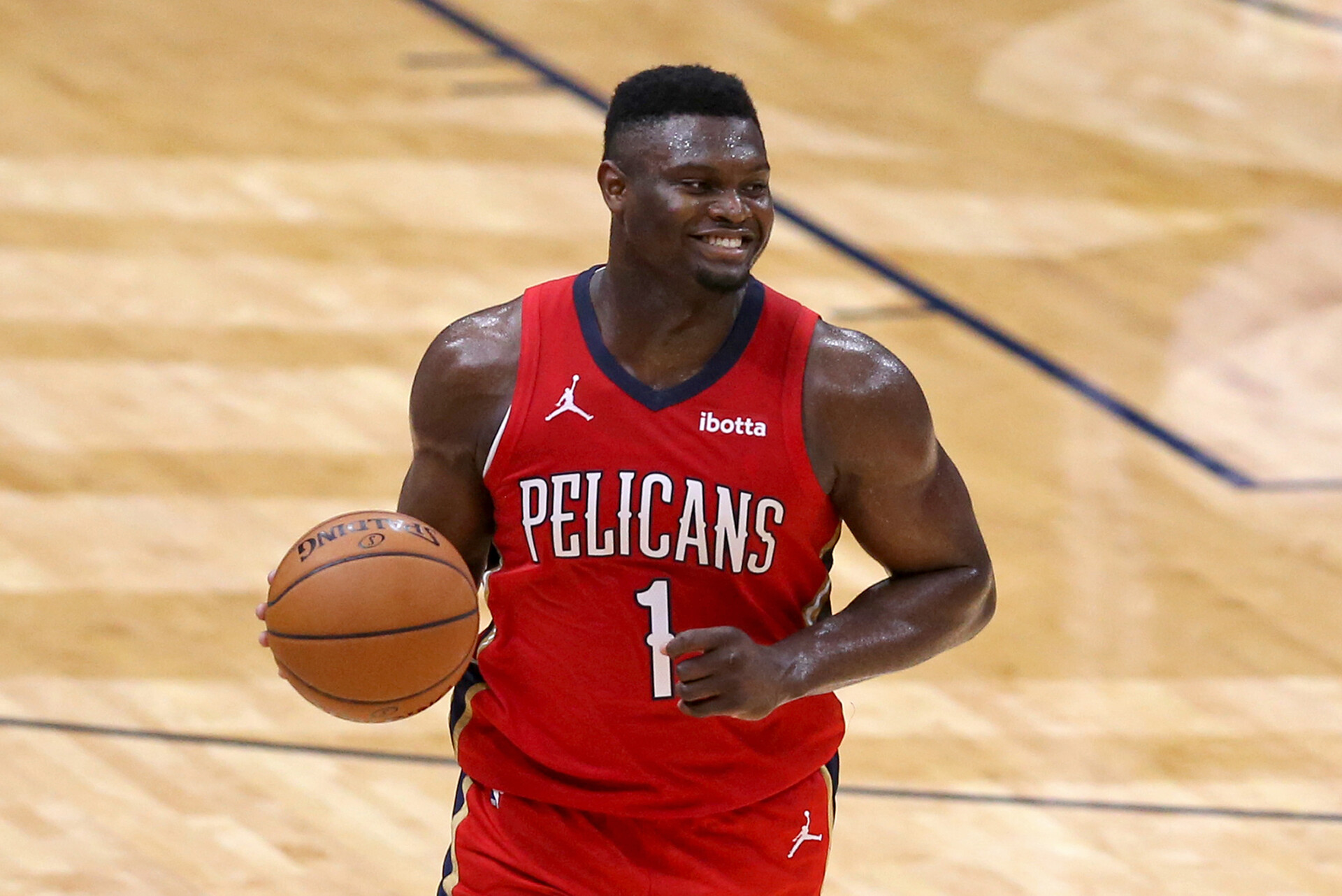 Zion Williamson dribbles down the court in a 2021 home game.