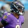 Baltimore Ravens quarterback #8 Lamar Jackson warms up before a 2020 game.