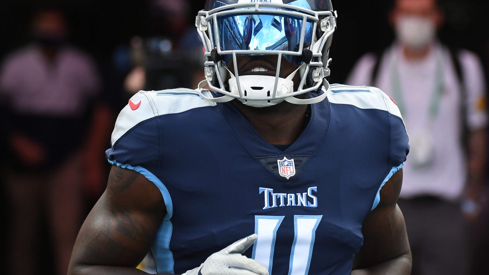 Tennessee Titans wide receiver #11 AJ Brown runs out of the tunnel prior to a 2020 home game.