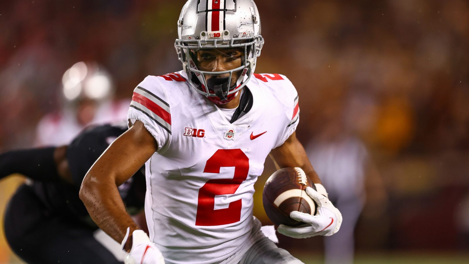 Ohio State receiver #2 Garrett Wilson looks for running room in a 2021 road game.