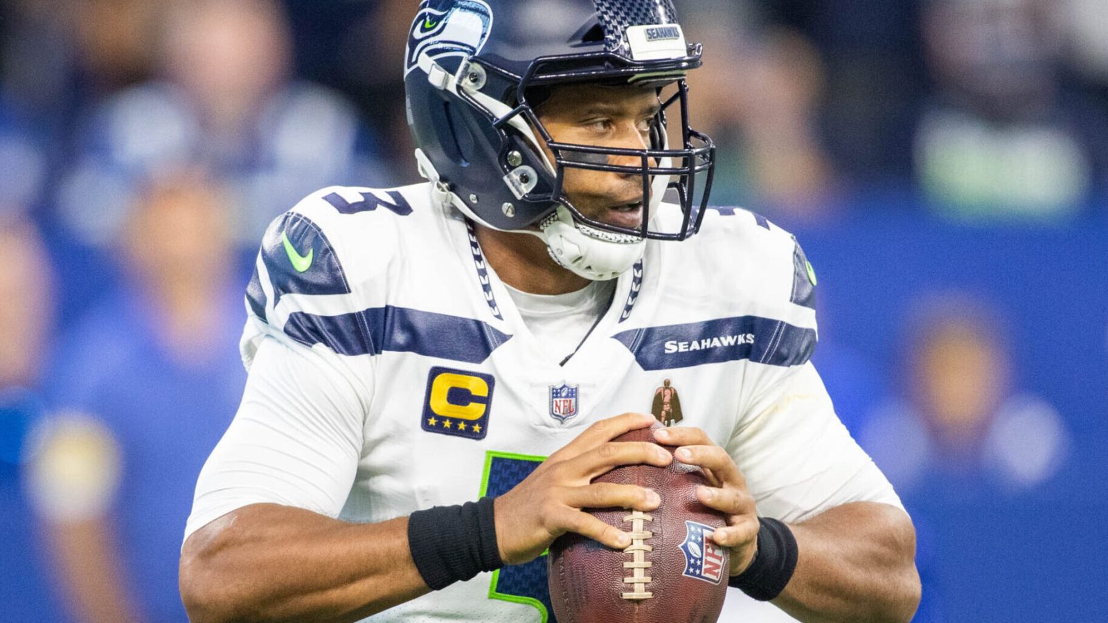 Seattle Seahawks quarterback Russell Wilson holds the football as he looks downfield to pass