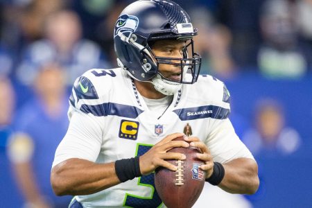 Seattle Seahawks quarterback Russell Wilson holds the football as he looks downfield to pass