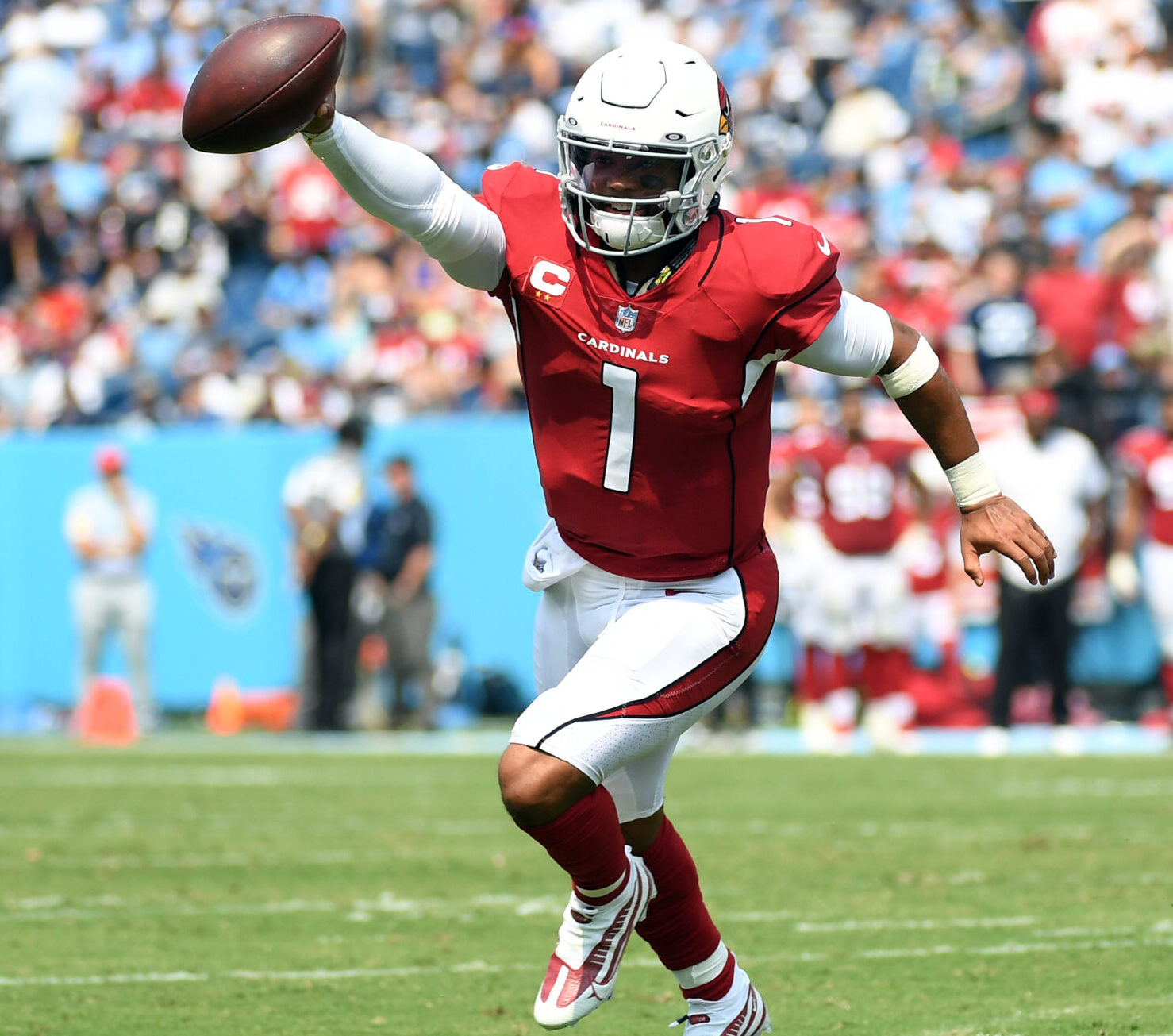 Arizona Cardinals quarterback Kyler Murray scrambles with the ball during a game at the Tennessee Titans