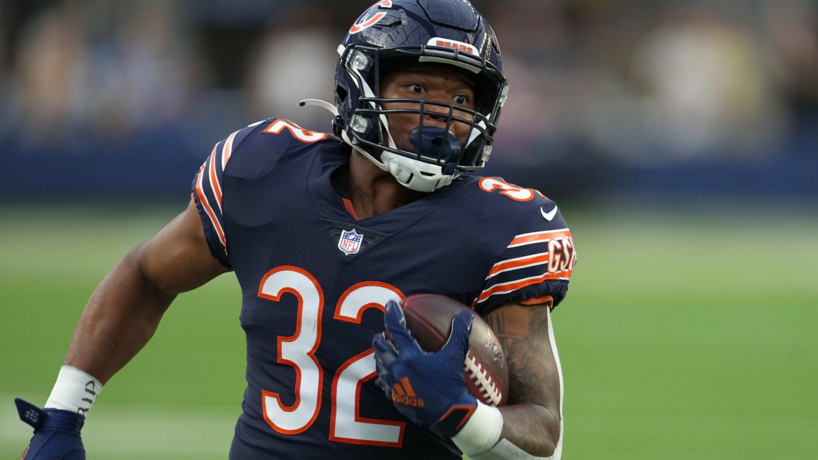 Bears running back #32 looks for running room in a 2021 home game.