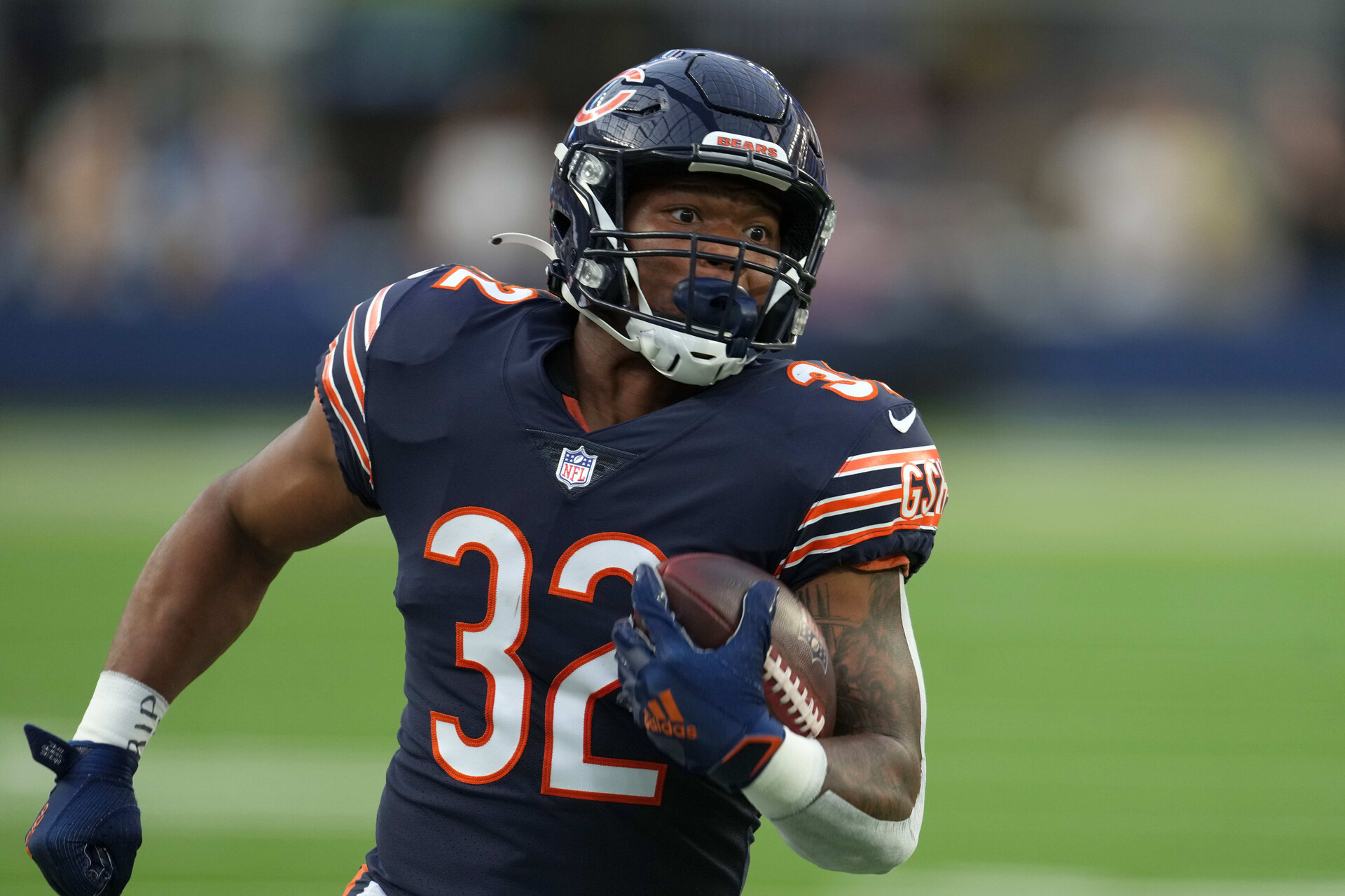 Bears running back #32 looks for running room in a 2021 home game.
