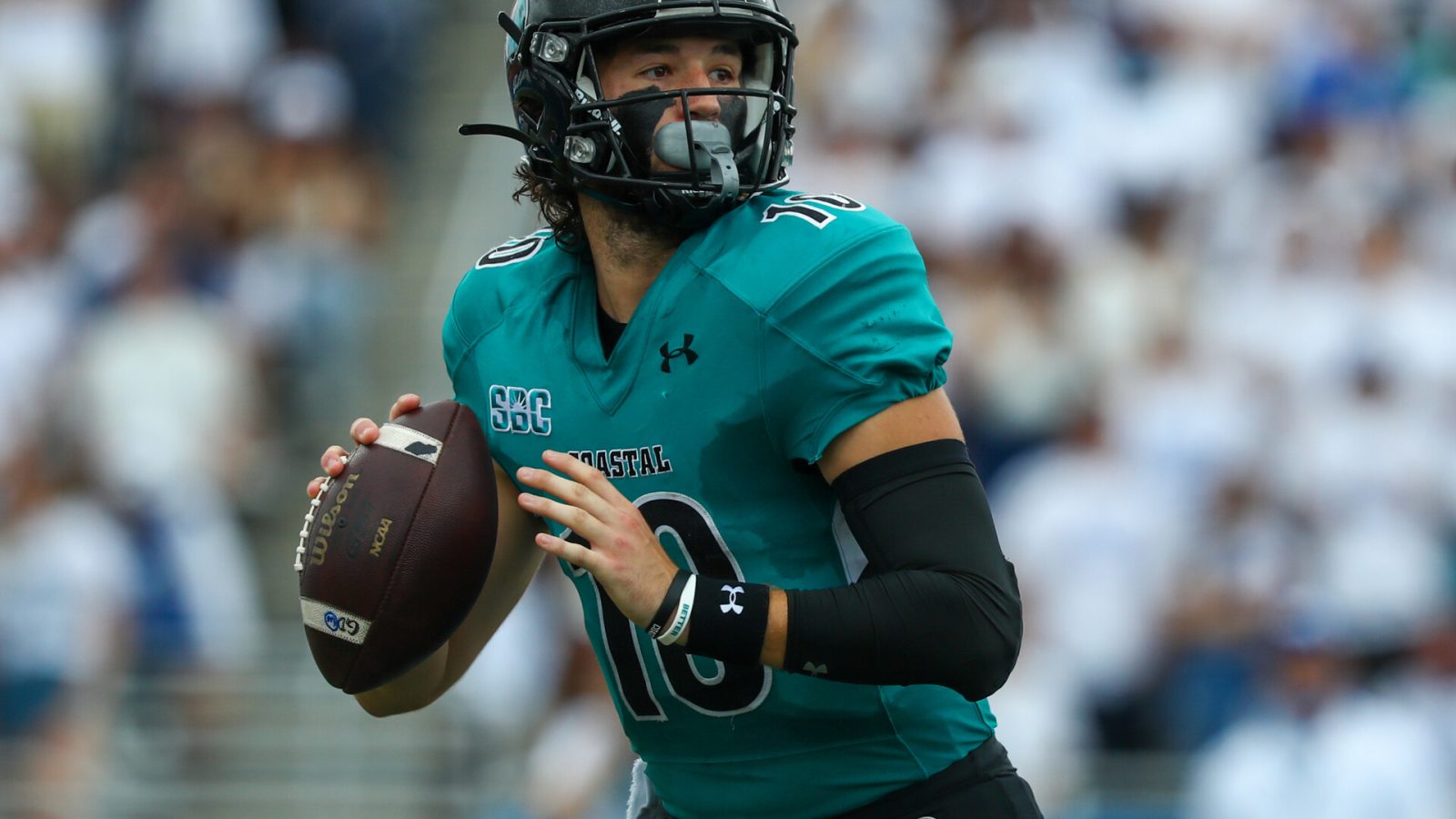 Coastal Carolina QB Grayson McCall looks downfield in a 2021 game.