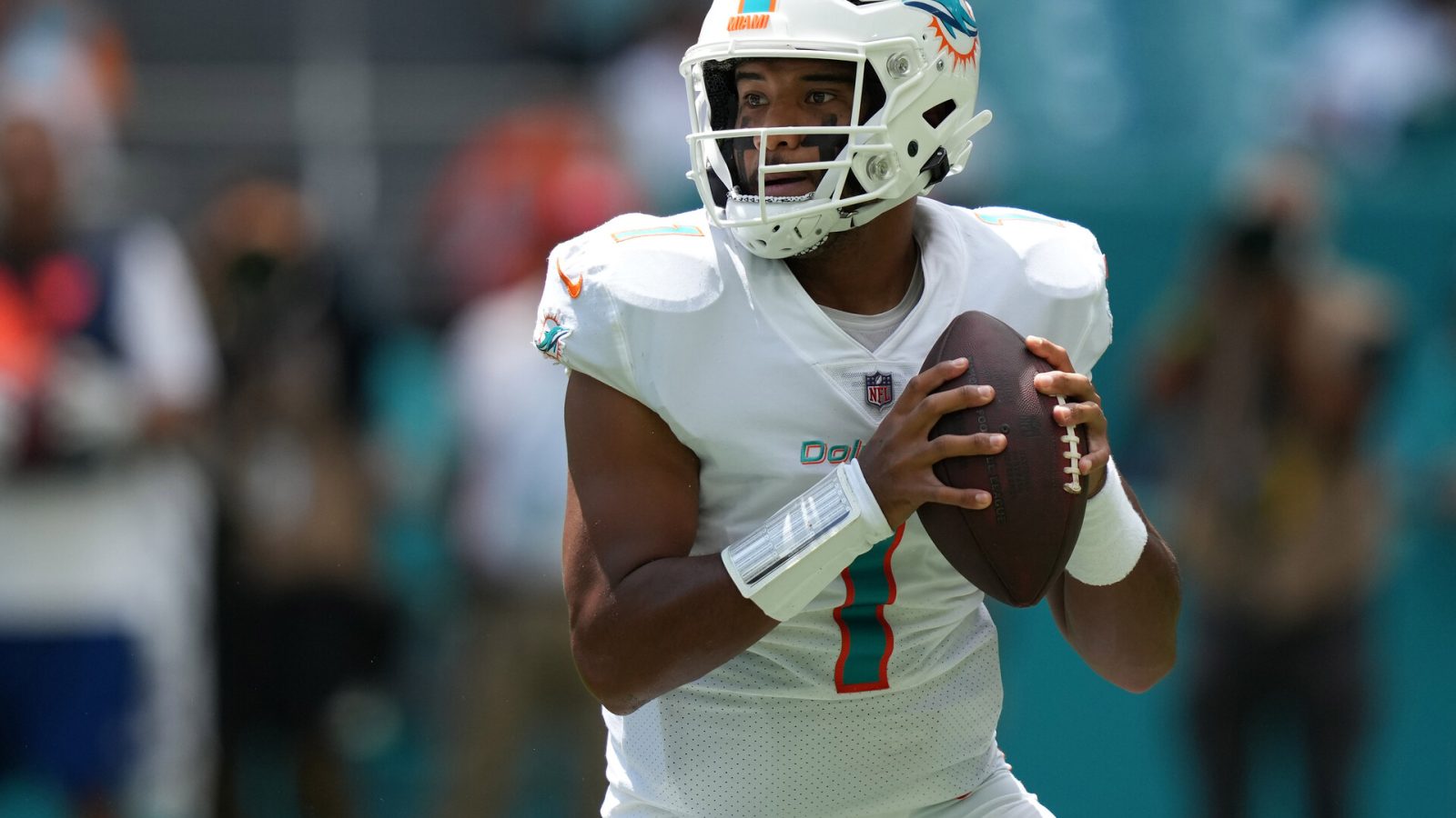 Miami Dolphins quarterback Tua Tagovailoa looks downfield in a 2021 road game.