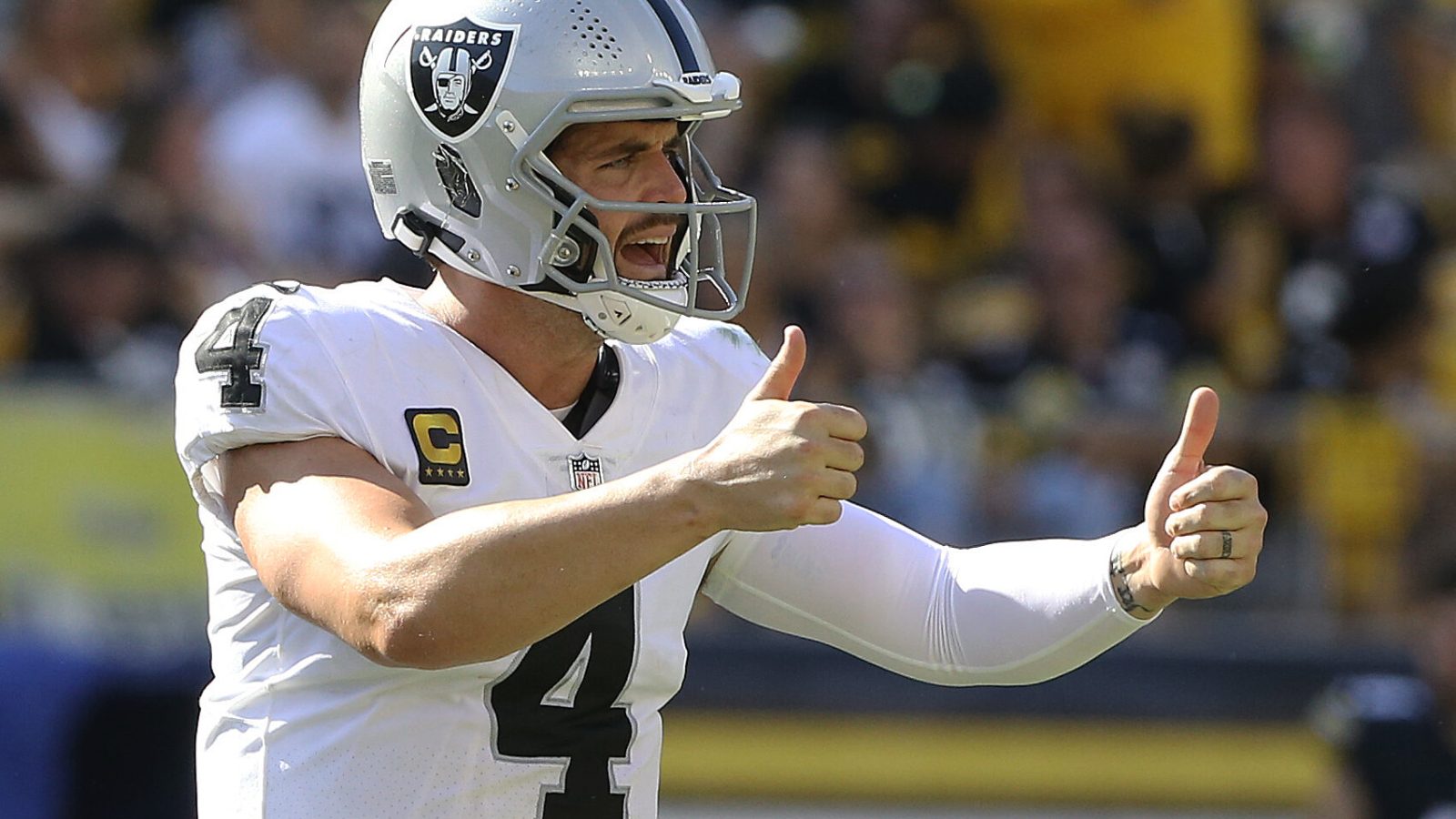 Las Vegas Raiders quarterback Derek Carr signals two thumbs up after making a play against the Pittsburgh Steelers