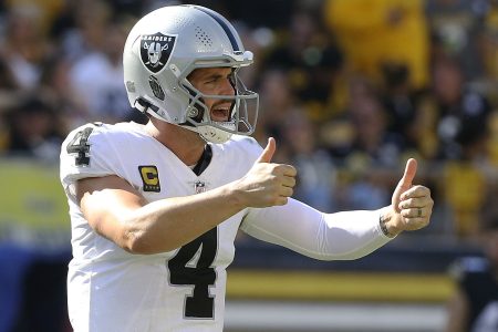 Las Vegas Raiders quarterback Derek Carr signals two thumbs up after making a play against the Pittsburgh Steelers