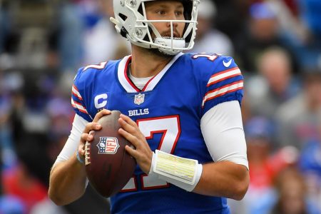 Buffalo Bills QB #17 Josh Allen looks downfield during a pass attempt in a 2021 home game in Buffalo, NY.