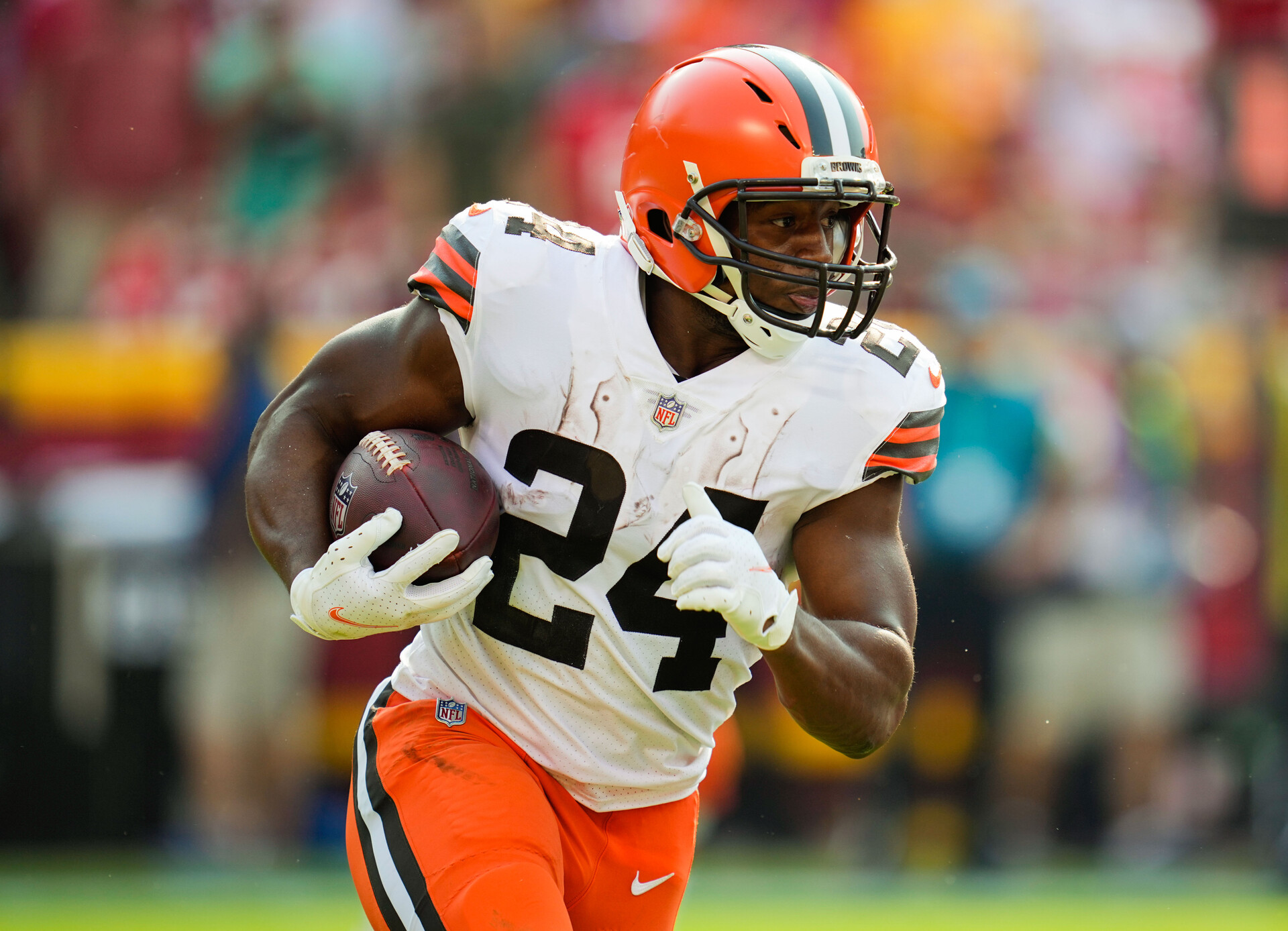 Cleveland Browns running back #24 Nick Chubb runs the ball in a 2021 road game.