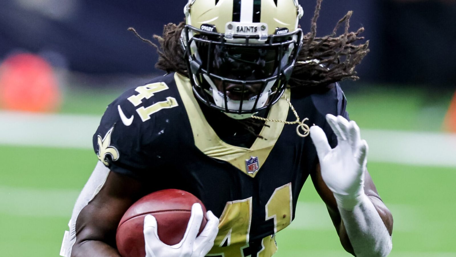 New Orleans Saints running back Alvin Kamara runs in the open field