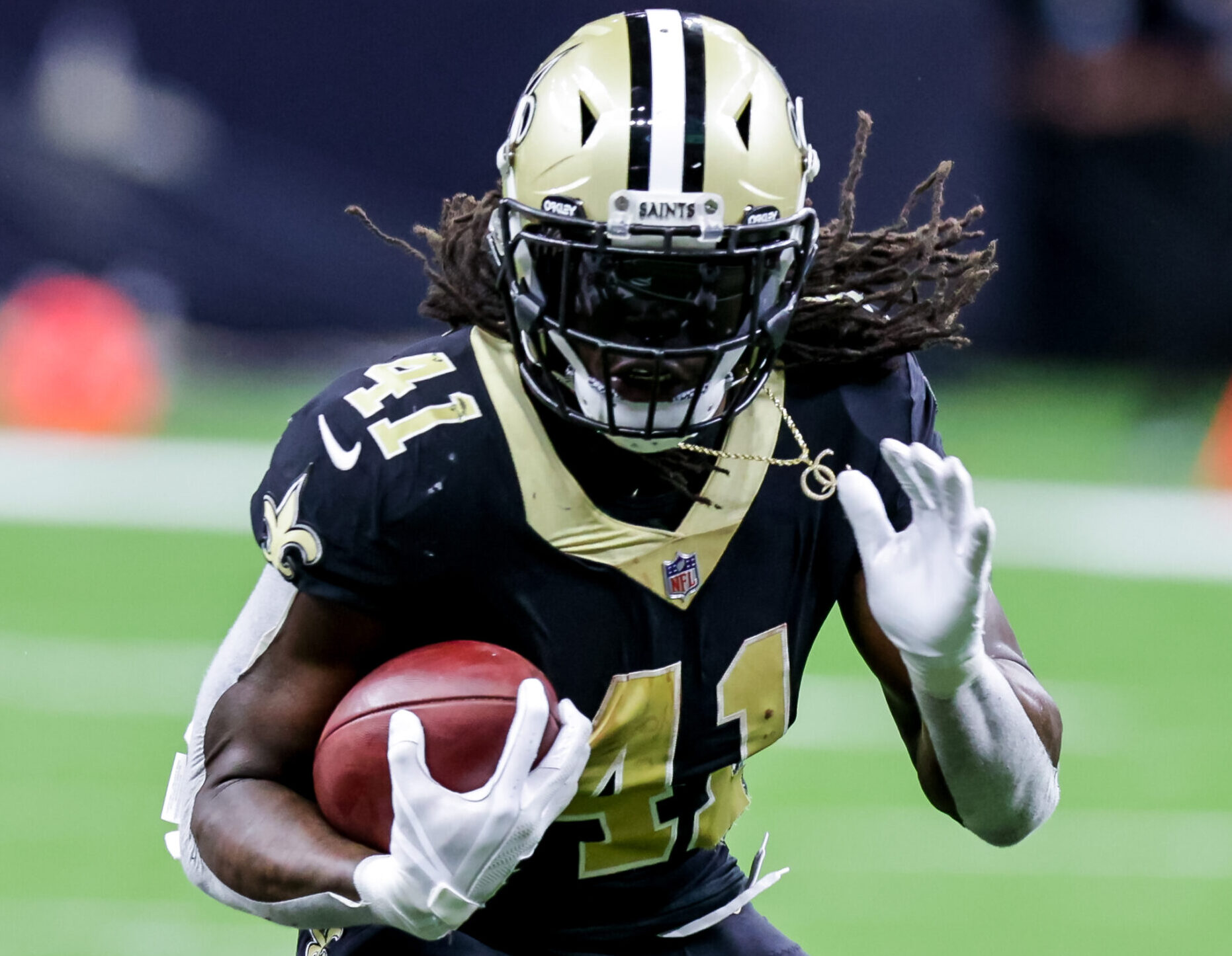 New Orleans Saints running back Alvin Kamara runs in the open field