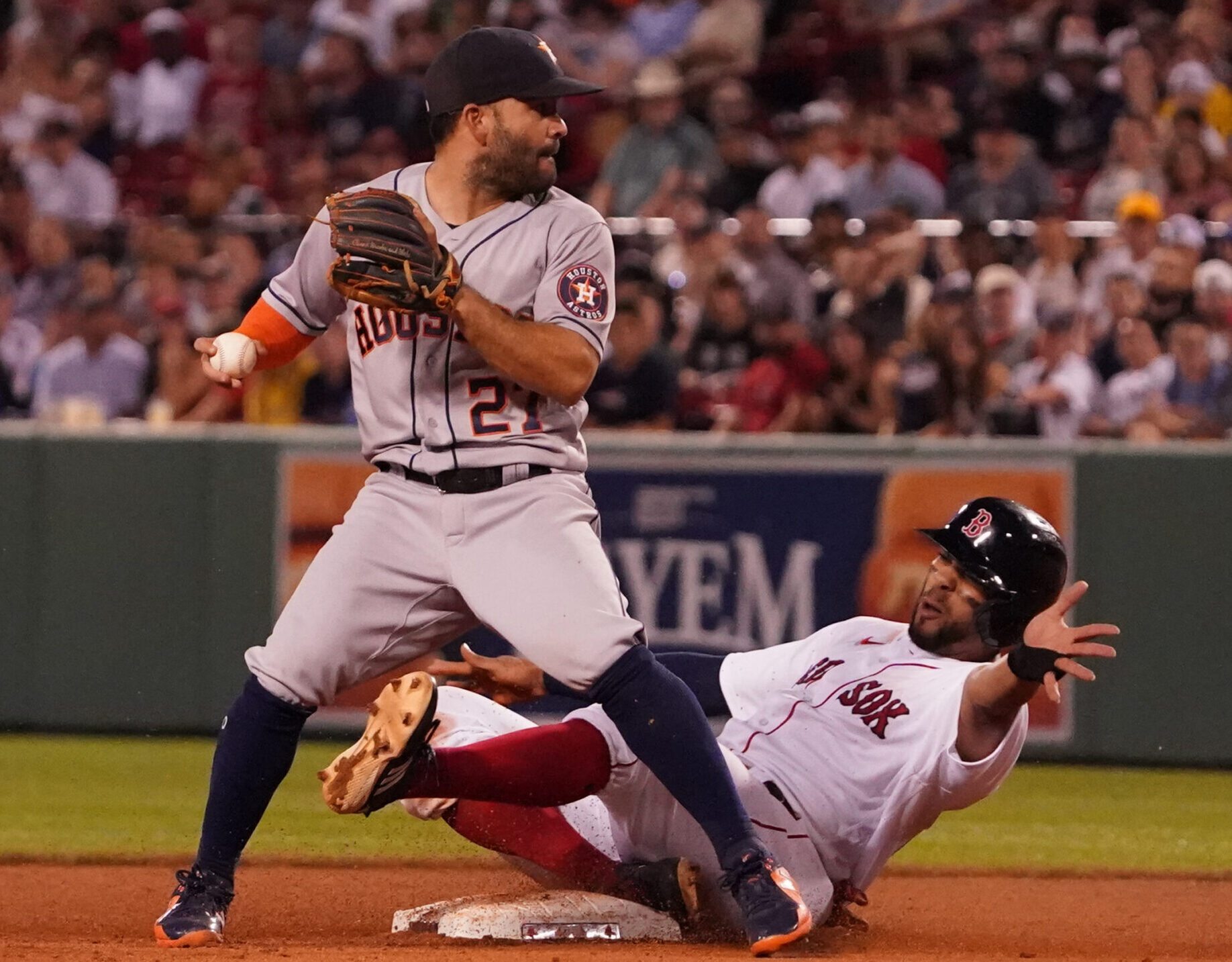 Houston Astros second baseman Jose Altuve forces out Boston Red Sox shortstop Xander Bogarts at second base