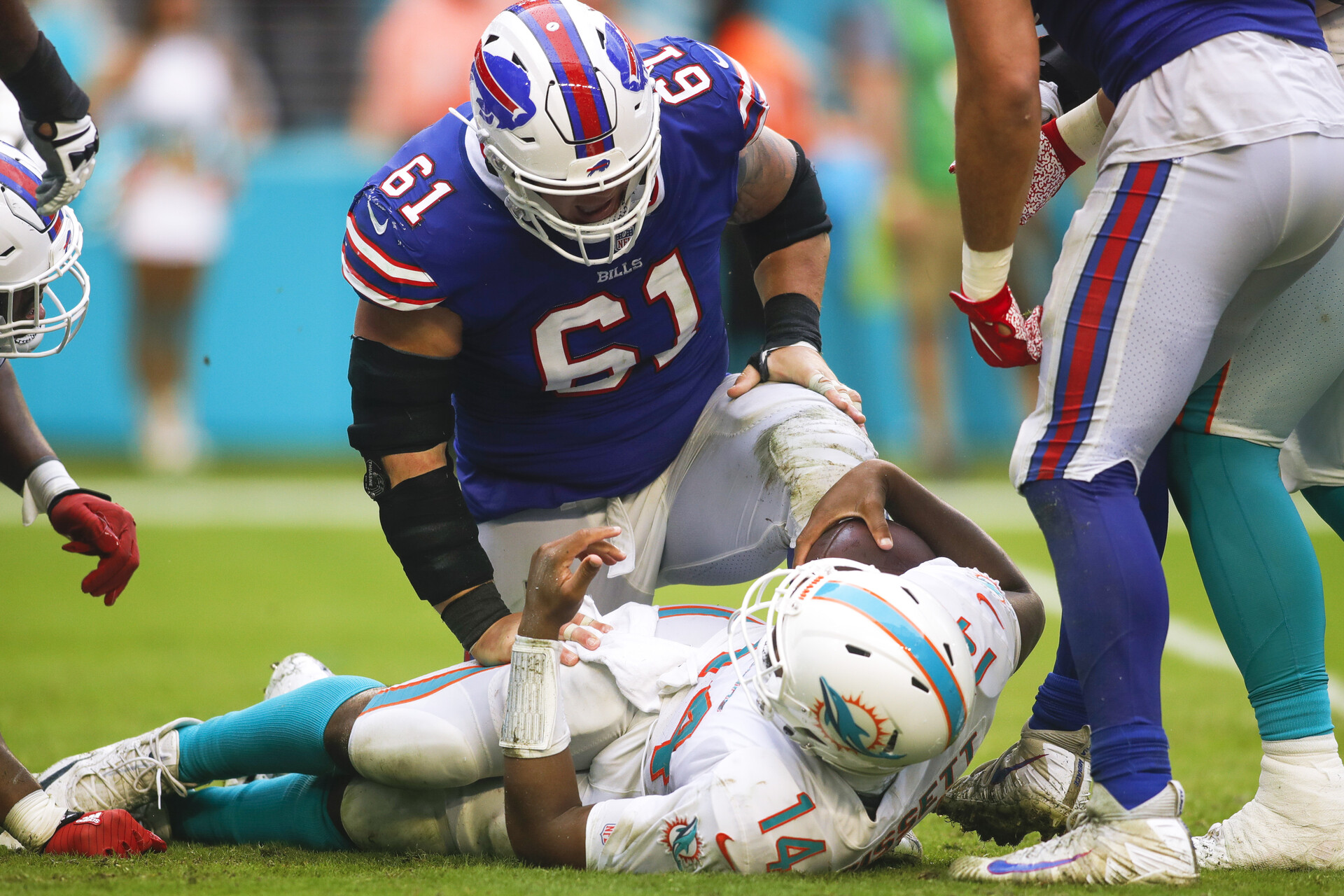 Buffalo Bills defensive tackle Justin Zimmer looks over Miami Dolphins quarterback Jacoby Brissett after sacking him