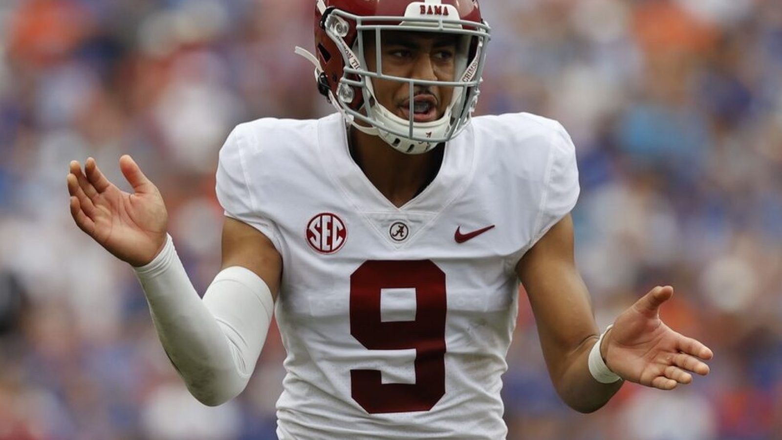 Alabama quarterback Bryce Young claps his hands together at the snap of the football