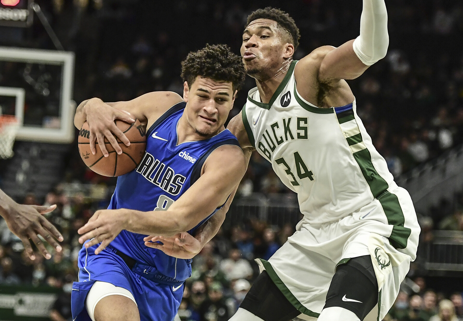 Dallas Mavericks guard Josh Green (on the left) drives for the basket against Milwaukee Bucks forward Giannis Antetokounmpo