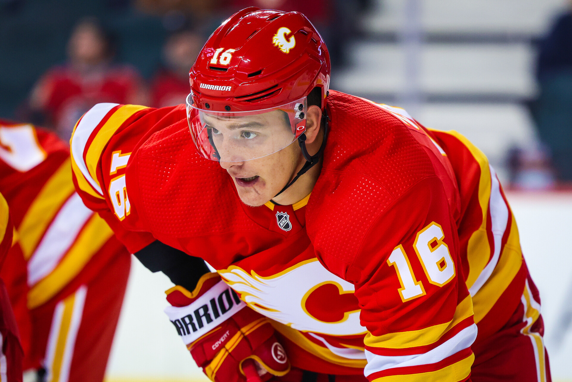 Calgary Flames defenseman Nikita Zadorov prepares to take a face-off in a preseason game