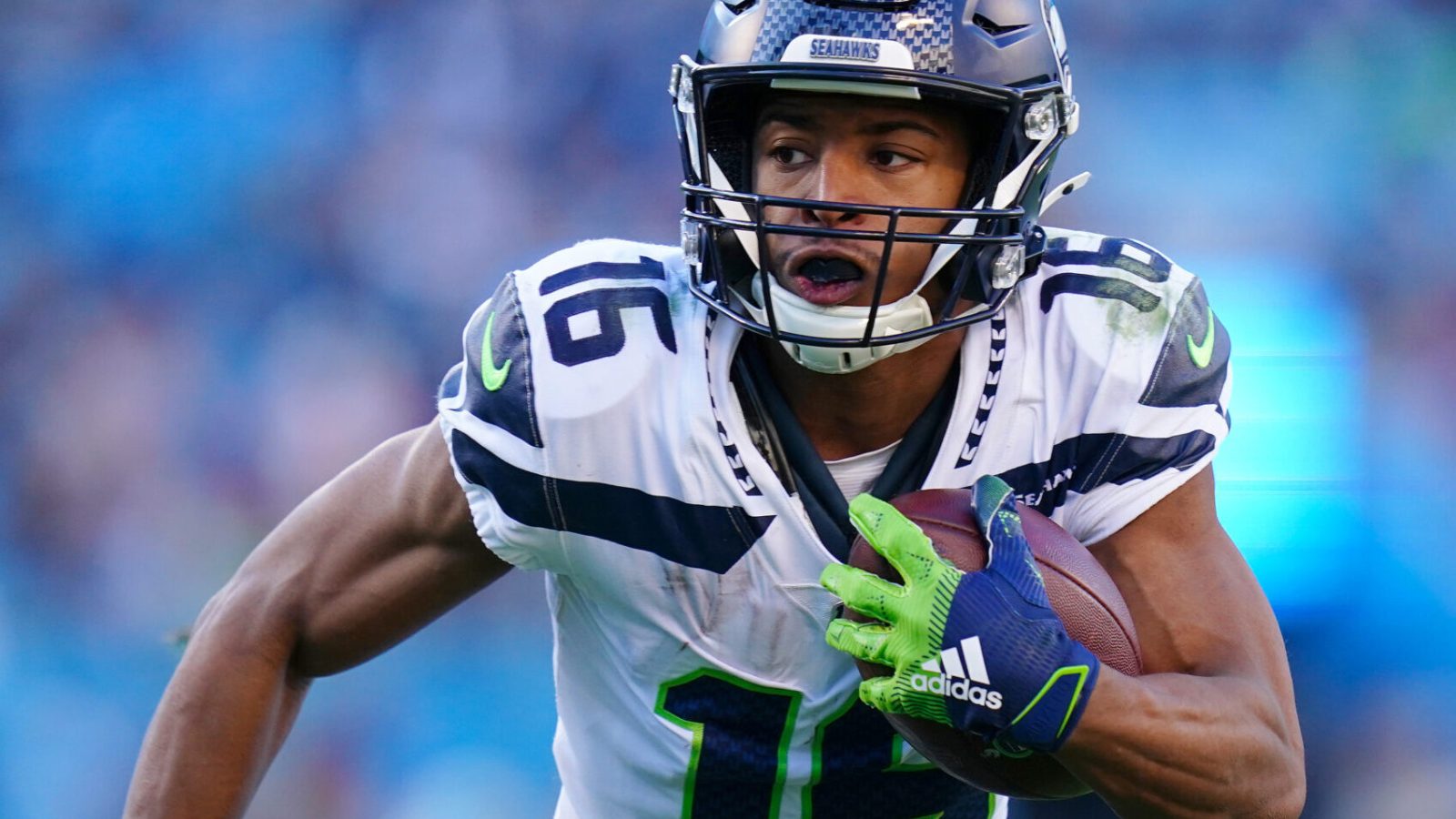 Seattle Seahawks wide receiver Tyler Lockett looks upfield during an NFL game in the 2021 regular season.
