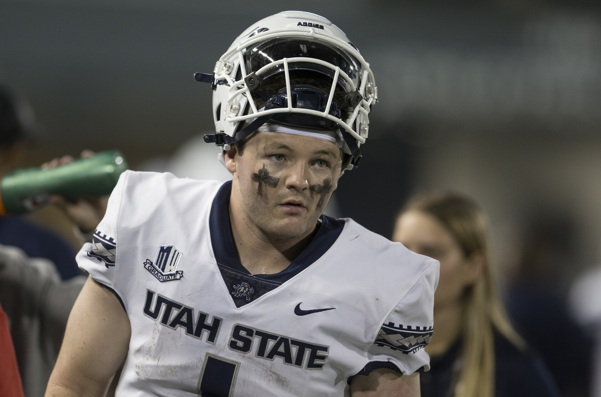 Logan Bonner #1 QB of Utah State looks on from the sideline.