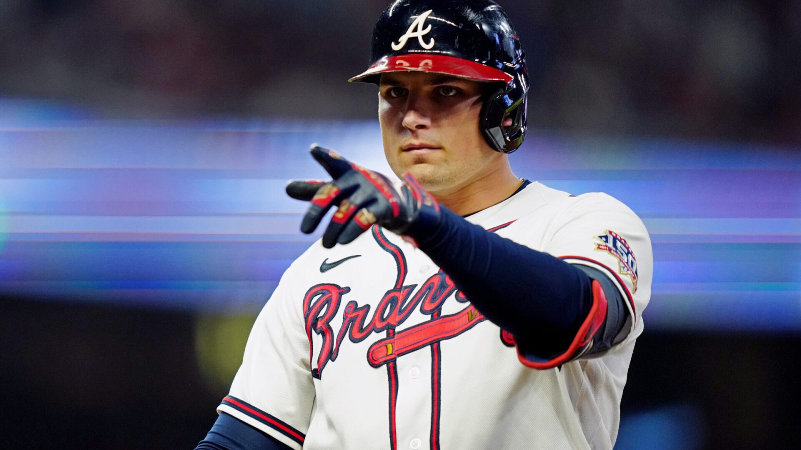 Atlanta Braves third baseman Austin Riley points with his left finger after getting a hit