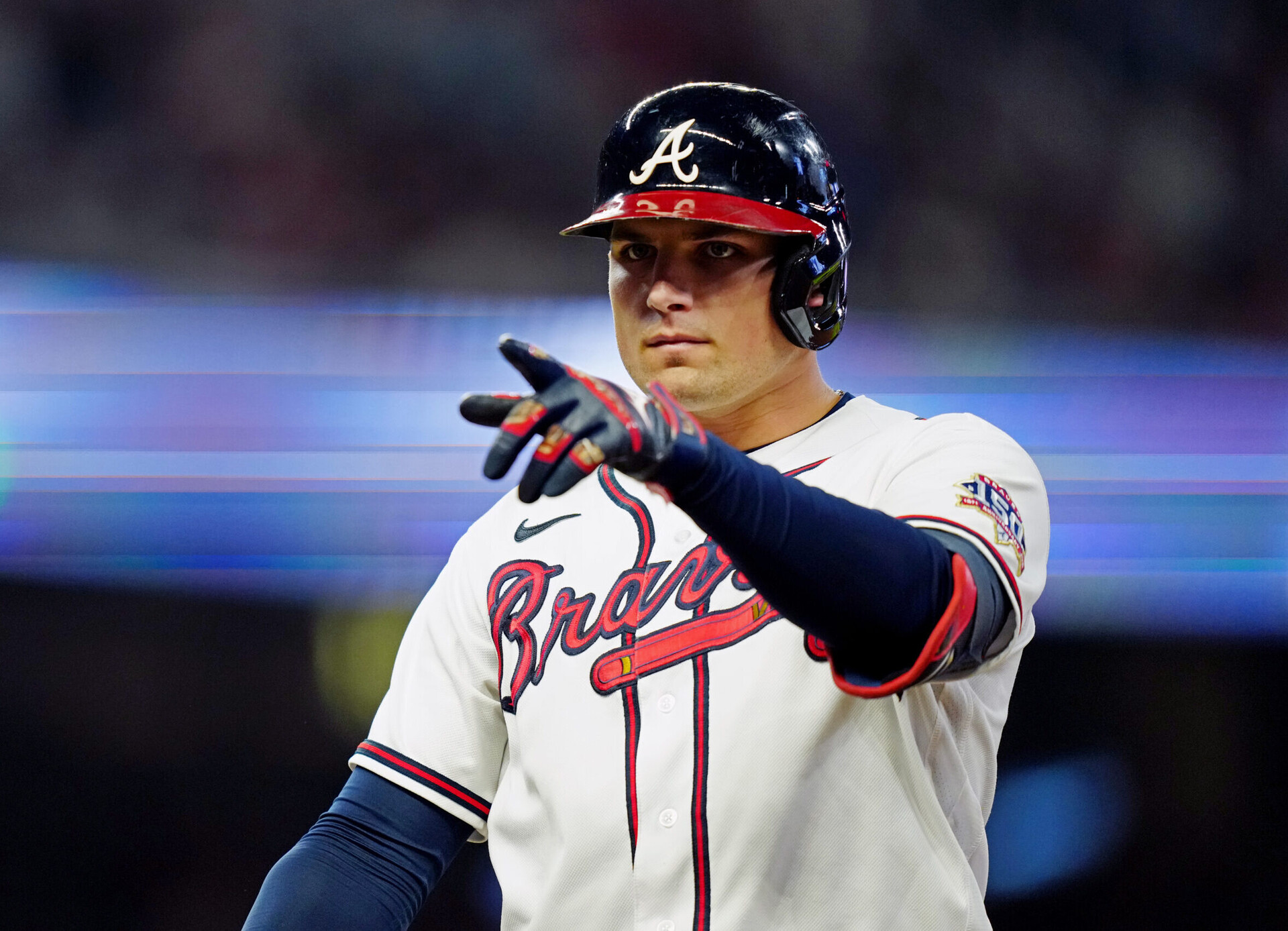 Atlanta Braves third baseman Austin Riley points with his left finger after getting a hit