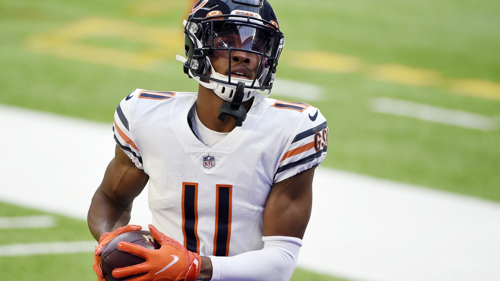 Chicago Bears WR #11 Darnell Mooney warms up before a 2021 road game.