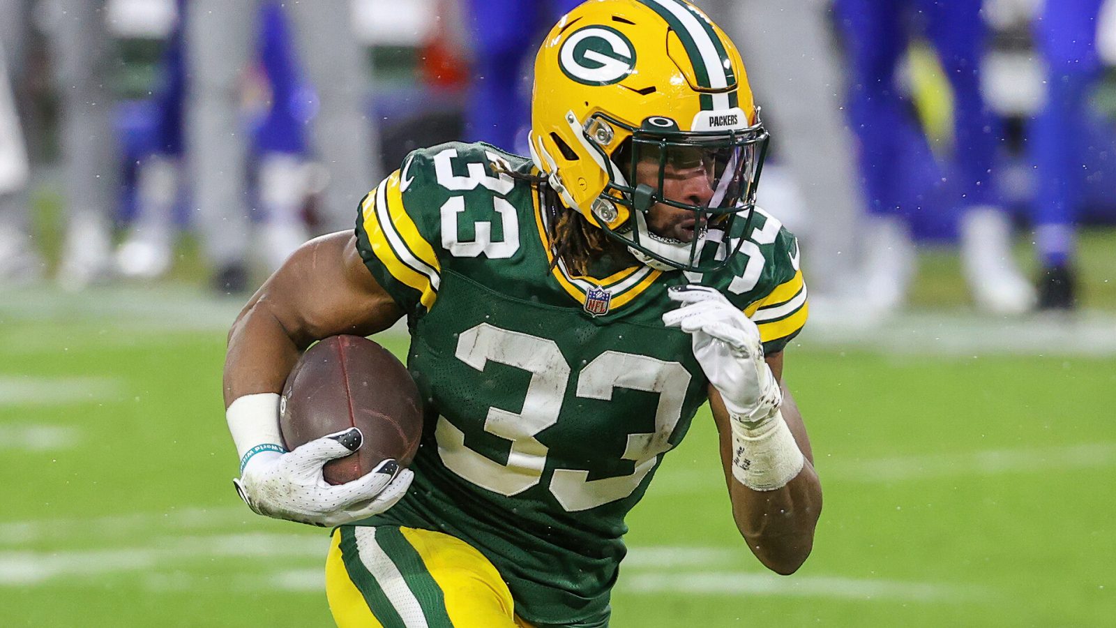 Aaron Jones runs the ball in a 2021 home game.