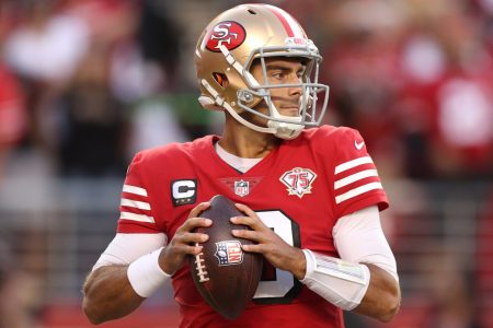 San Francisco quarterback #10 Jimmy Garoppolo looks downfield for a receiver in a 2021 home game.